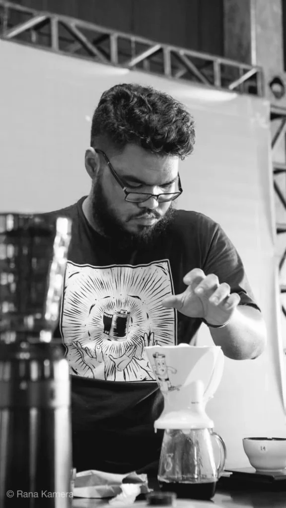 Muhammad Fakhri brewing pour-over coffee during competition
