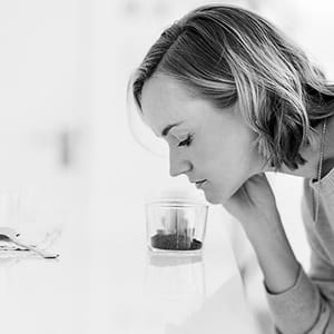 Carly Green tasting specialty coffee during a cupping session